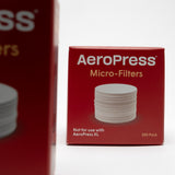 small red box of aeropress filters. 350 replacement AeroPress micro-filters compatible with AeroPress Original, Go & Clear Coffee Maker. pictured on a white background.